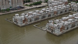 AX78_112 - 4.8K aerial stock footage of Waterfront Pier Homes At HarborView condos in Baltimore, Maryland
