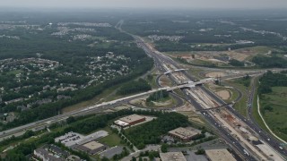 AX78_131E - 4.8K aerial stock footage flying over office buildings by I-95 to approach suburban neighborhoods in Baltimore, Maryland