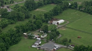 AX78_142 - 4.8K aerial stock footage of a farmhouse and barn in Joppa, Maryland