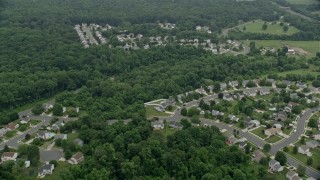 AX78_145 - 4.8K aerial stock footage flying over tract homes and trees in Abigdon, Maryland