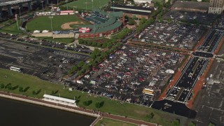 AX79_003 - 4.8K aerial stock footage of tailgating at parking lot by Campbell's Field, Camden, New Jersey