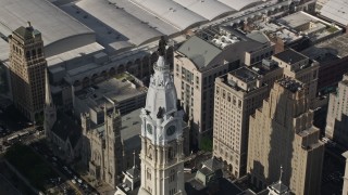 AX79_014E - 4.8K aerial stock footage William Penn statue atop Philadelphia City Hall, Pennsylvania