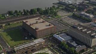 AX79_081 - 4.8K aerial stock footage of a factory building at The Navy Yard in Philadelphia, Pennsylvania