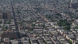 AX79_085 - 4.8K aerial stock footage of urban neighborhoods and S 7th Street in South Philadelphia, Pennsylvania