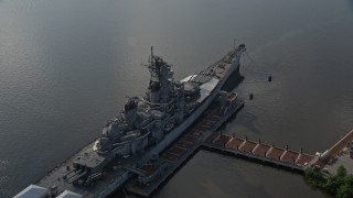 AX79_093 - 4.8K aerial stock footage approaching and flying over USS New Jersey on Delaware River, Camden, New Jersey