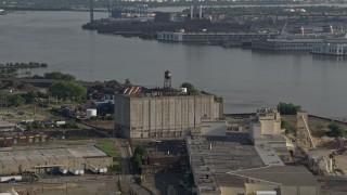 AX79_095 - 4.8K aerial stock footage of a factory building beside the Delaware River, Camden, New Jersey