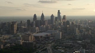 AX80_005 - 4.8K aerial stock footage of the Downtown Philadelphia skyline and Pennsylvania Convention Center, Pennsylvania, Sunset