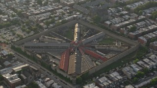 AX80_015 - 4.8K aerial stock footage of Eastern State Penitentiary in Philadelphia, Pennsylvania, Sunset