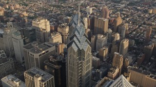 AX80_018 - 4.8K aerial stock footage tilting to bird's eye of One and Two Liberty Place in Downtown Philadelphia, Pennsylvania, Sunset