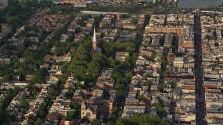 AX80_020 - 4.8K aerial stock footage of St Peter's Episcopal Church in an urban neighborhood, Philadelphia, Philadelphia, Sunset