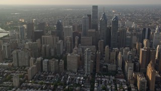 AX80_021E - 4.8K aerial stock footage of Downtown Philadelphia skyscrapers and high-rises in Pennsylvania, Sunset
