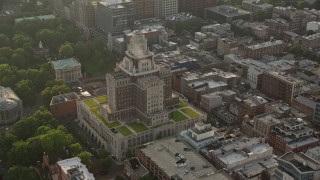 AX80_029 - 4.8K aerial stock footage orbiting the United States Customs House at sunset in Philadelphia, Pennsylvania