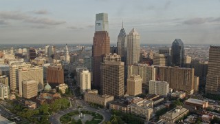AX80_046 - 4.8K aerial stock footage of Comcast Center, BNY Mellon Center, and Three Logan Square in Downtown Philadelphia, Pennsylvania, Sunset