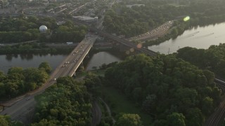 AX80_053 - 4.8K aerial stock footage approaching Girard Bridge spanning the Schuylkill River in Philadelphia, Pennsylvania, Sunset