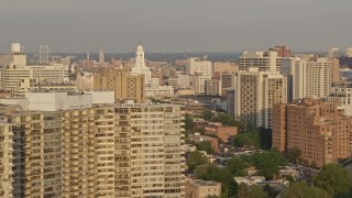AX80_067 - 4.8K aerial stock footage of office and apartment buildings around Inquirer Building in Downtown Philadelphia, Pennsylvania, Sunset