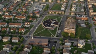AX80_070 - 4.8K aerial stock footage of a community center and church in North Philadelphia, Pennsylvania Sunset