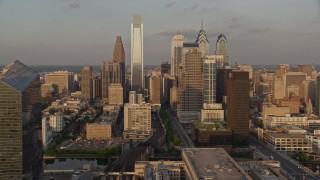 AX80_086 - 4.8K aerial stock footage video of Downtown Philadelphia skyscrapers, Pennsylvania, Sunset