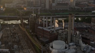 AX80_088 - 4.8K stock footage aerial video of Veolia Energy power plant in South Philadelphia, Pennsylvania, Sunset