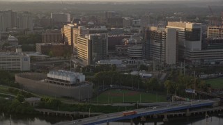 AX80_089 - 4.8K aerial stock footage of Meiklejohn Stadium and Children's Hospital of Philadelphia, Pennsylvania, Sunset