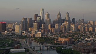 AX80_090E - 4.8K aerial stock footage of Downtown Philadelphia skyline seen from Schuylkill River, Pennsylvania, Sunset