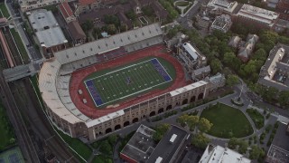 AX80_106 - 4.8K aerial stock footage of a bird's eye view of Franklin Field at University of Pennsylvania, West Philadelphia, Sunset