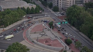 AX80_141 - 4.8K aerial stock footage of the Bolt of Lightning sculpture, Franklin Square, Philadelphia, Pennsylvania, Sunset