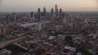 AX80_155 - 4.8K aerial stock footage of Downtown Philadelphia skyline, Pennsylvania Convention Center, and I-676, Pennsylvania, Sunset