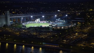 AX81_003 - 4.8K aerial stock footage of a baseball game at Campbell's Field, Camden, New Jersey Night