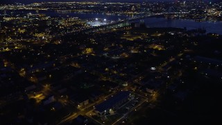 AX81_006 - 4.8K aerial stock footage orbiting fireworks in an urban neighborhood, Camden, New Jersey Night