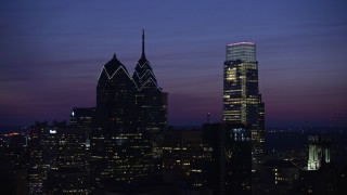 AX81_016 - 4.8K aerial stock footage of One and Two Liberty Place, Comcast Center, Downtown Philadelphia, Pennsylvania, Night
