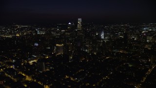 AX81_061E - 4.8K aerial stock footage approach Downtown Philadelphia skyscrapers from south of the city, Pennsylvania, Night