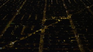 AX81_070 - 4.8K aerial stock footage of urban neighborhoods and city streets, South Philadelphia, Pennsylvania Night