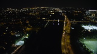 AX81_077 - 4.8K aerial stock footage approaching and tilting to South Street Bridge over the Schuylkill River, Philadelphia, Pennsylvania, Night