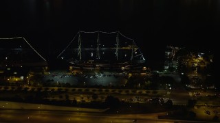 AX81_082 - 4.8K aerial stock footage of historic ship Moshulu in Philadelphia, Pennsylvania, Night