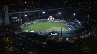 AX81_089 - 4.8K aerial stock footage of a baseball game at Campbell's Field in Camden, New Jersey, Night