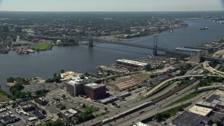 AX82_006 - 4.8K aerial stock footage of Benjamin Franklin Bridge and Delaware River, Philadelphia, Pennsylvania