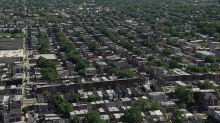 AX82_021 - 4.8K aerial stock footage flying by row houses in an urban neighborhood in North Philadelphia, Pennsylvania