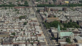 AX82_028E - 4.8K stock footage aerial video of churches in a urban neighborhood, North Philadelphia, Pennsylvania