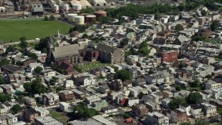 AX82_031 - 4.8K aerial stock footage of All Saints Catholic Church and cemetery, North Philadelphia, Pennsylvania