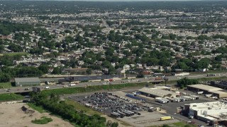 AX82_032 - 4.8K aerial stock footage of Interstate 95 and urban neighborhoods, Philadelphia, Pennsylvania