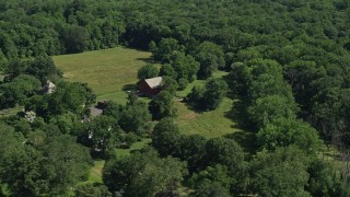 AX82_041 - 4.8K aerial stock footage of a barn on a small farm in Bensalem, Pennsylvania