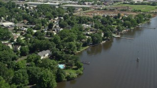 AX82_042 - 4.8K aerial stock footage of waterfront homes by the Delaware River in Bensalem, Pennsylvania