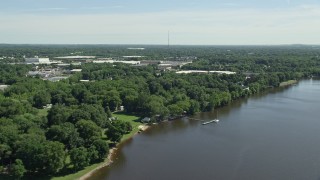 AX82_043 - 4.8K aerial stock footage of warehouse buildings by the Delaware River, Bensalem, Pennsylvania