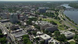 AX82_066 - 4.8K aerial stock footage of New Jersey State House, Trenton War Memorial, park, and office buildings, Trenton, New Jersey