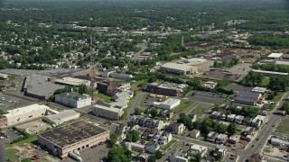 AX82_075 - 4.8K aerial stock footage of urban homes and warehouse buildings in Trenton, New Jersey