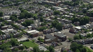 AX82_076 - 4.8K aerial stock footage of row houses and apartment buildings in Trenton, New Jersey
