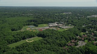 AX82_078 - 4.8K stock footage aerial video flying over Notre Dame High School and football field in Lawrence Township, New Jersey