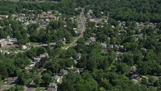 AX82_079 - 4.8K aerial stock footage flying by suburban neighborhood in Lawrence Township, New Jersey