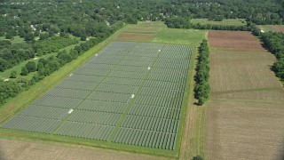 AX82_084 - 4.8K aerial stock footage of solar panels and farm fields in Lawrenceville, New Jersey
