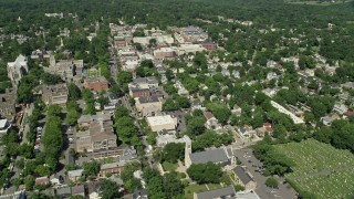 AX82_096 - 4.8K aerial stock footage flying over homes to approach shops and restaurants in Princeton, New Jersey